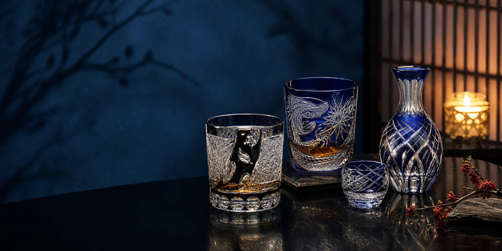Japanese cut glassware arranged in a quiet indigo interior